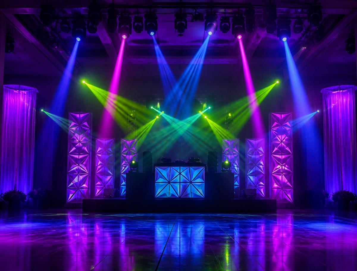 Prepared DJ stage with colourful venue lighting